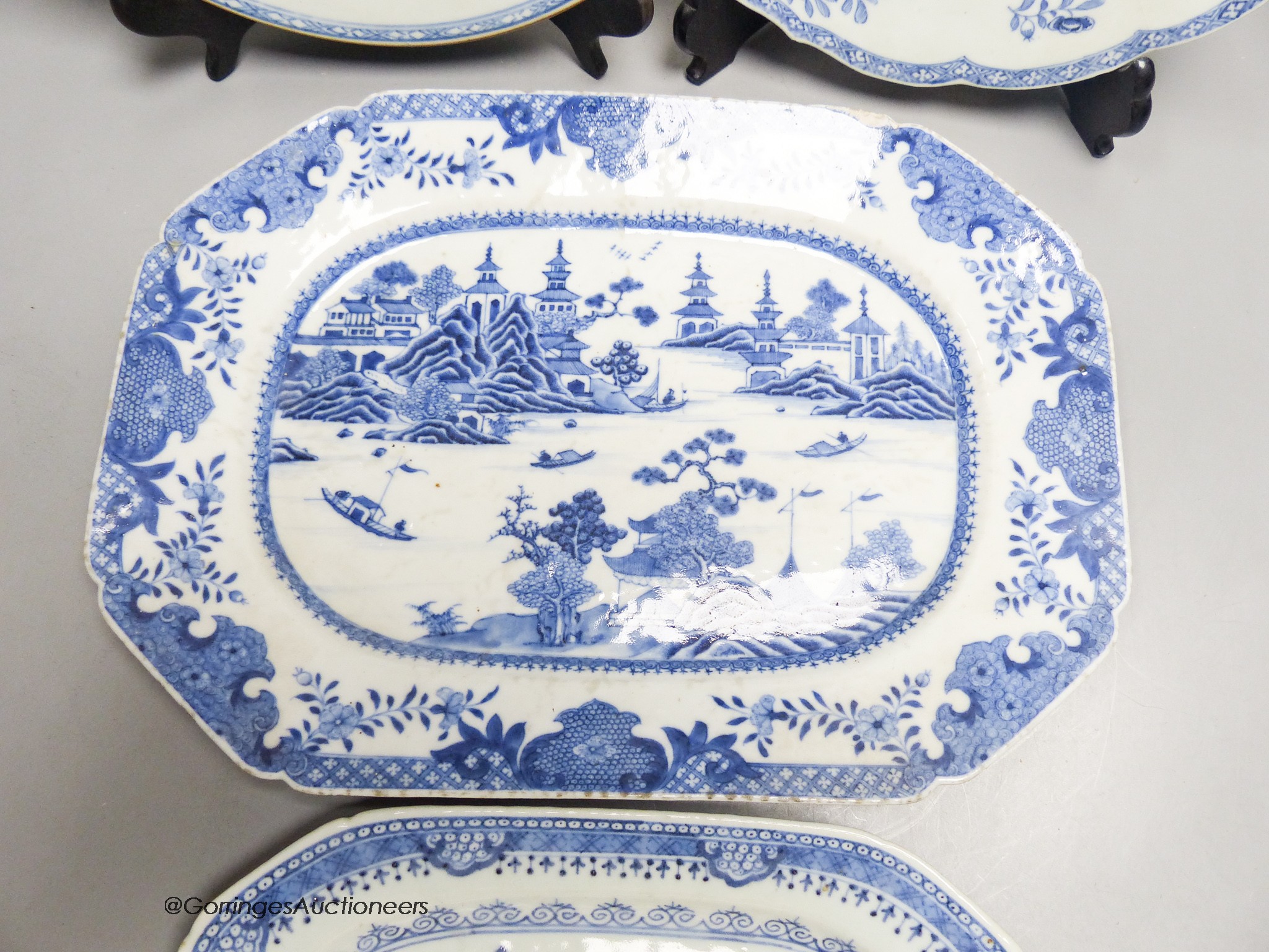 Two 18th century Chinese circular export plates and two canted rectangular dishes, 32 x 23cm
